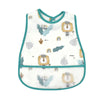 White waterproof baby bib with a cartoon pattern featuring lions, leaves, and rainbows.
