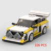 A yellow and white classic rally car model built from building blocks.