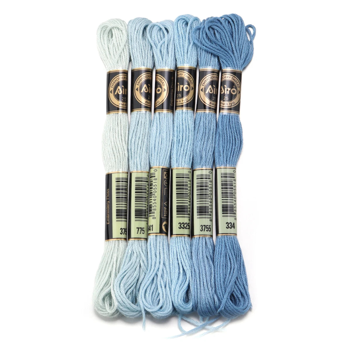A set of six skeins of vibrant embroidery thread in various shades of light blue and teal for cross stitch and DIY crafts