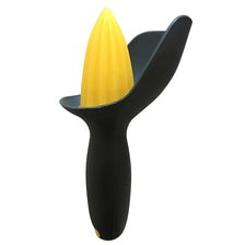 Black manual citrus juicer with a yellow citrus press cone.