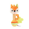An orange fox plush toy with a yellow tongue and a green rattle attached.