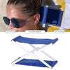 A blue foldable camp pillow shown in an X-shaped, lightweight design.