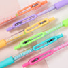 A collection of six colorful acrylic gel pens in various shades including orange, purple, yellow, green, and blue.
