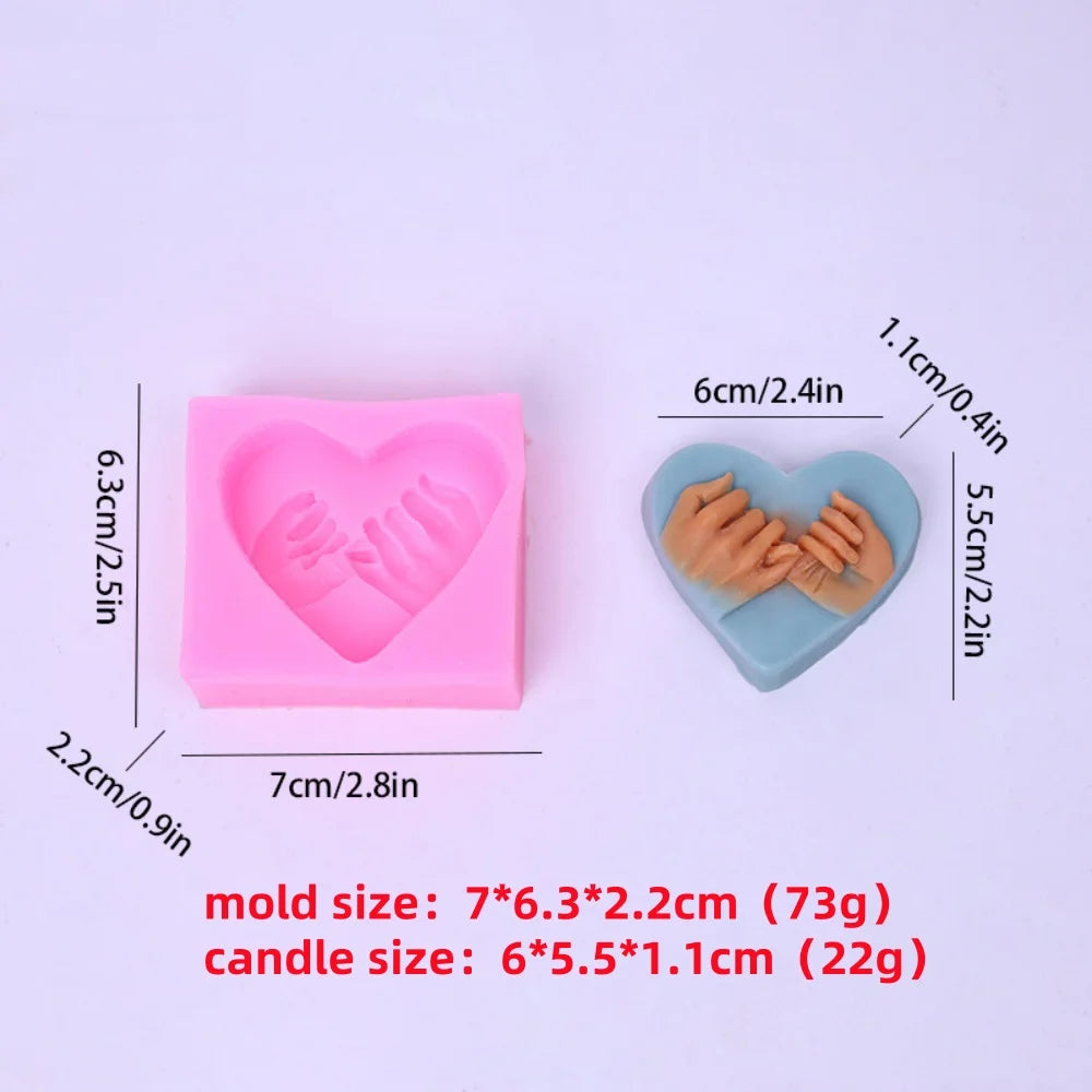 Pink silicone mold shaped like a heart used for making candles or soaps.