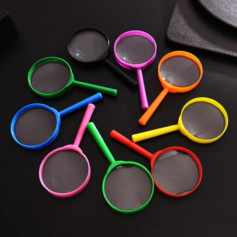 A collection of colorful magnifying glasses with various colored handles and circular lenses on a dark surface.