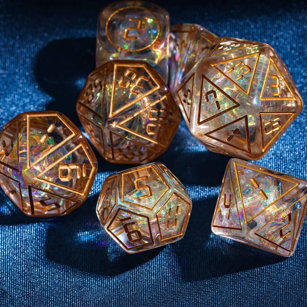 A collection of seven amber-colored polyhedral dice set on a dark blue surface.
