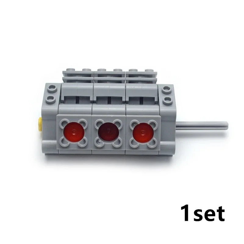 A gray motor and servo set for building blocks with red components.