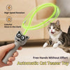 A hand holds a glow-in-the-dark automatic cat teaser toy with a green wire, demonstrating its use for a pet.