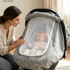 A woman is easily putting a baby into a breathable stroller sunshade cover for quick access.