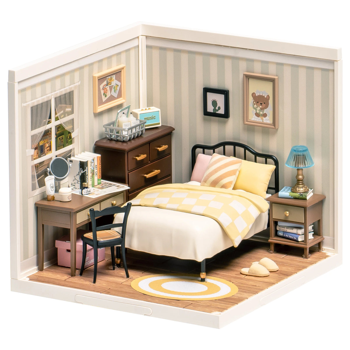A miniature dollhouse kit depicting a sweet dream bedroom with wooden furniture and striped wallpaper.