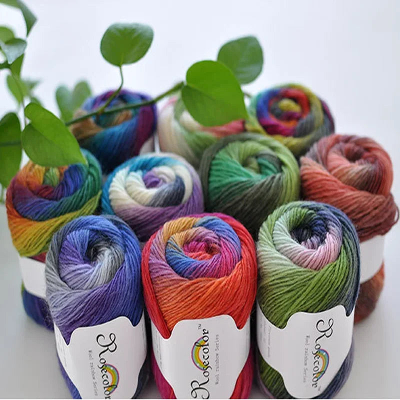 A collection of hand-dyed rainbow merino wool yarn skeins in various shades and colors.