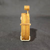 A small wooden dice puzzle kit model showing a vertical structure built from stacked, textured wooden pieces.