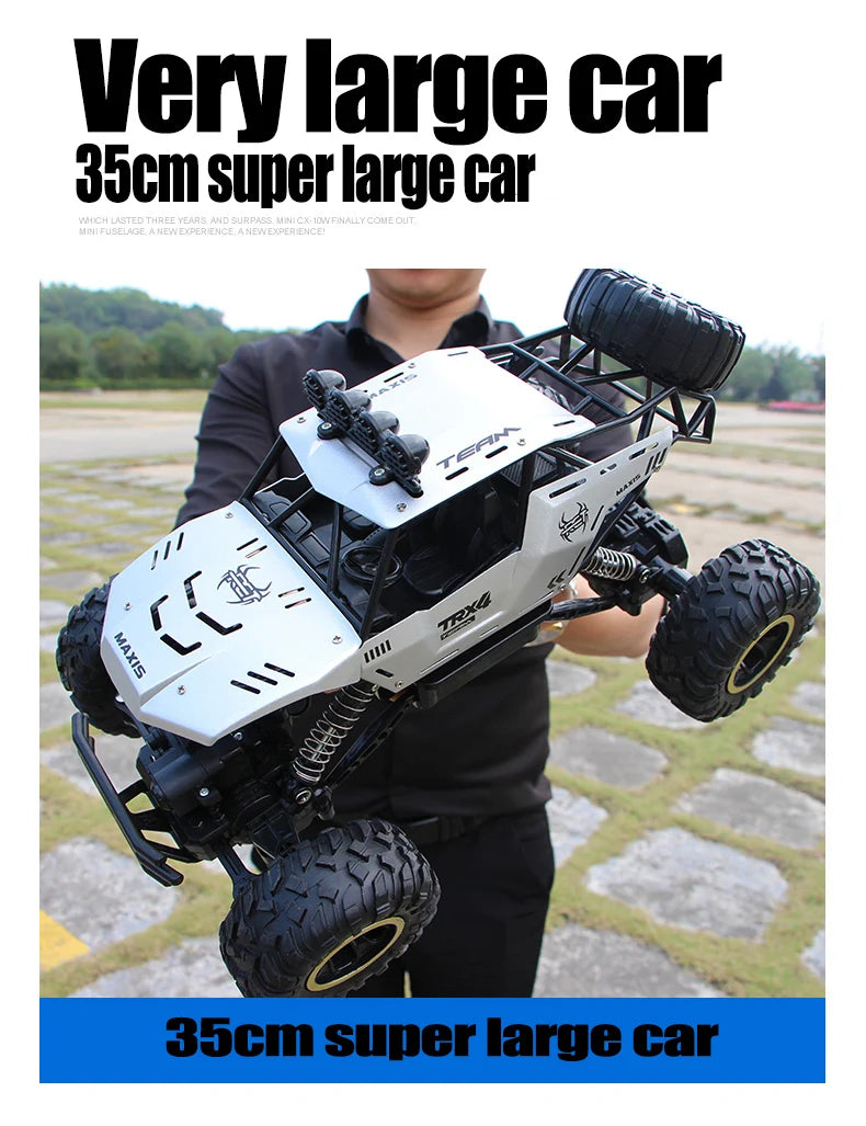 A person holds a white and black high-speed 4WD off-road RC truck with large tires and LED lights.