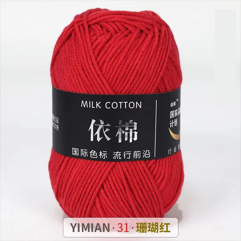 A ball of red milk cotton yarn labeled with Chinese characters and a YIMIAN brand mark.