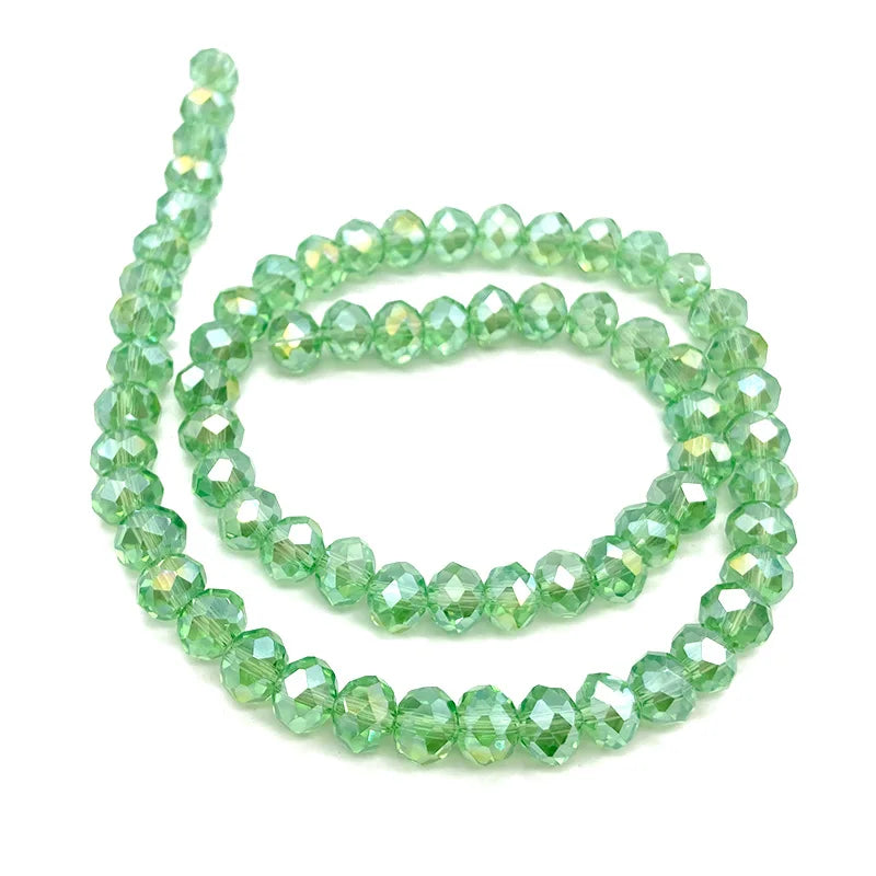 Green faceted crystal beads strung together for jewelry making