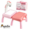 A pink projector unit with a unicorn head and a drawing pad, shown next to its carrying case.