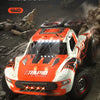Orange and white off-road vehicle demonstrating strong climbing ability with a front and rear metal differential.