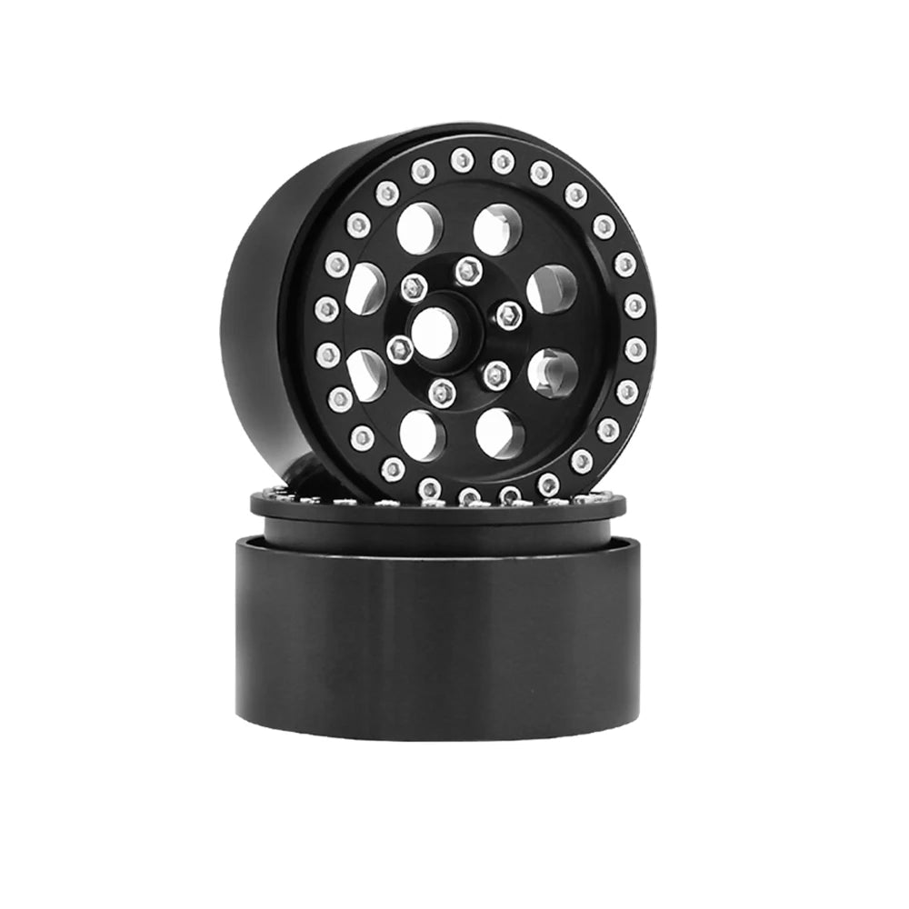 Black metal beadlock wheels for an RC crawler with a removable hex hub.