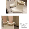 A pair of beige and white waterproof mid-calf rain boots with a non-slip sole displayed on a surface.