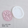 A pink silicone resin mold set featuring heart, round, oval, and rectangle shapes displayed next to a white mold container.