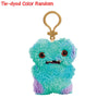 Tie-dyed color random Fuggler funny plush monster keychain with a quirky rabbit design