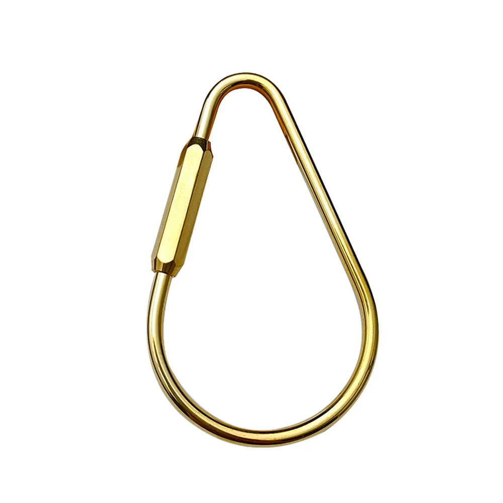 A brass keychain with a locking carabiner clip, shown against a white background.