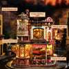 A detailed wooden 3D puzzle model of a coffee factory with various lighting effects.