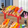 A colorful mini barbecue pretend play set featuring various food items like sausages, vegetables, and fruits for children's p