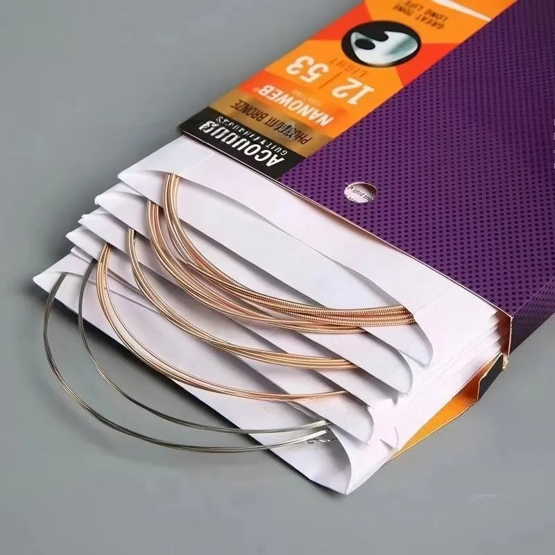 A set of anti-rust coated acoustic guitar strings is displayed in a purple and orange packaging box.