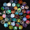 A collection of seven polyhedral resin dice in various colors and patterns for tabletop gaming.