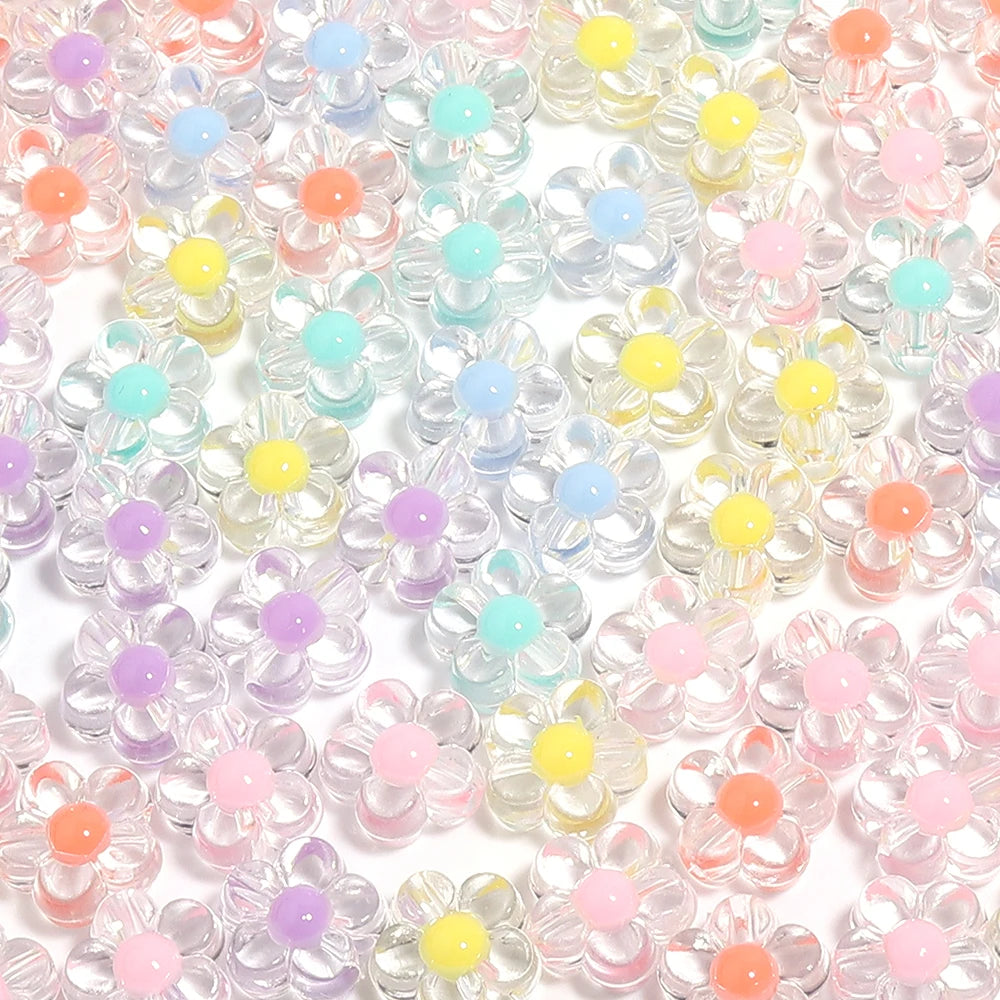 A close-up of small, colorful transparent acrylic flower beads in various pastel shades.