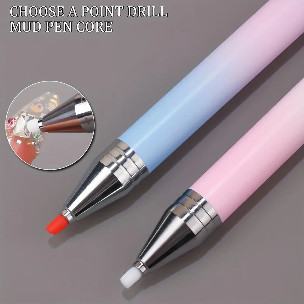 A close-up view of a gradient rotating dotting pen with a pink and blue barrel and silver tip.