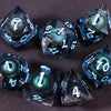 A collection of seven polyhedral resin dice, including a d20 and d12, resting on a dark surface.