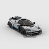 A detailed model of a classic supercar built from gray and black building blocks.