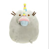 A soft gray plush cat toy with a pink and blue horn and a light blue mouth detail.