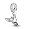 Sterling silver charm bead shaped like a bird with wings and a loop for bracelet making
