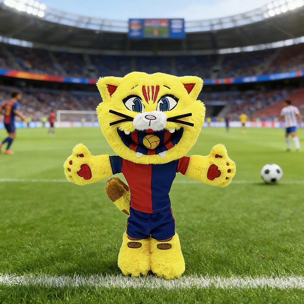 A yellow and orange cat mascot plush toy dressed in a football uniform standing on a green field.