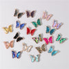 A collection of crystal butterfly charm beads in various colors and shades for jewelry making.