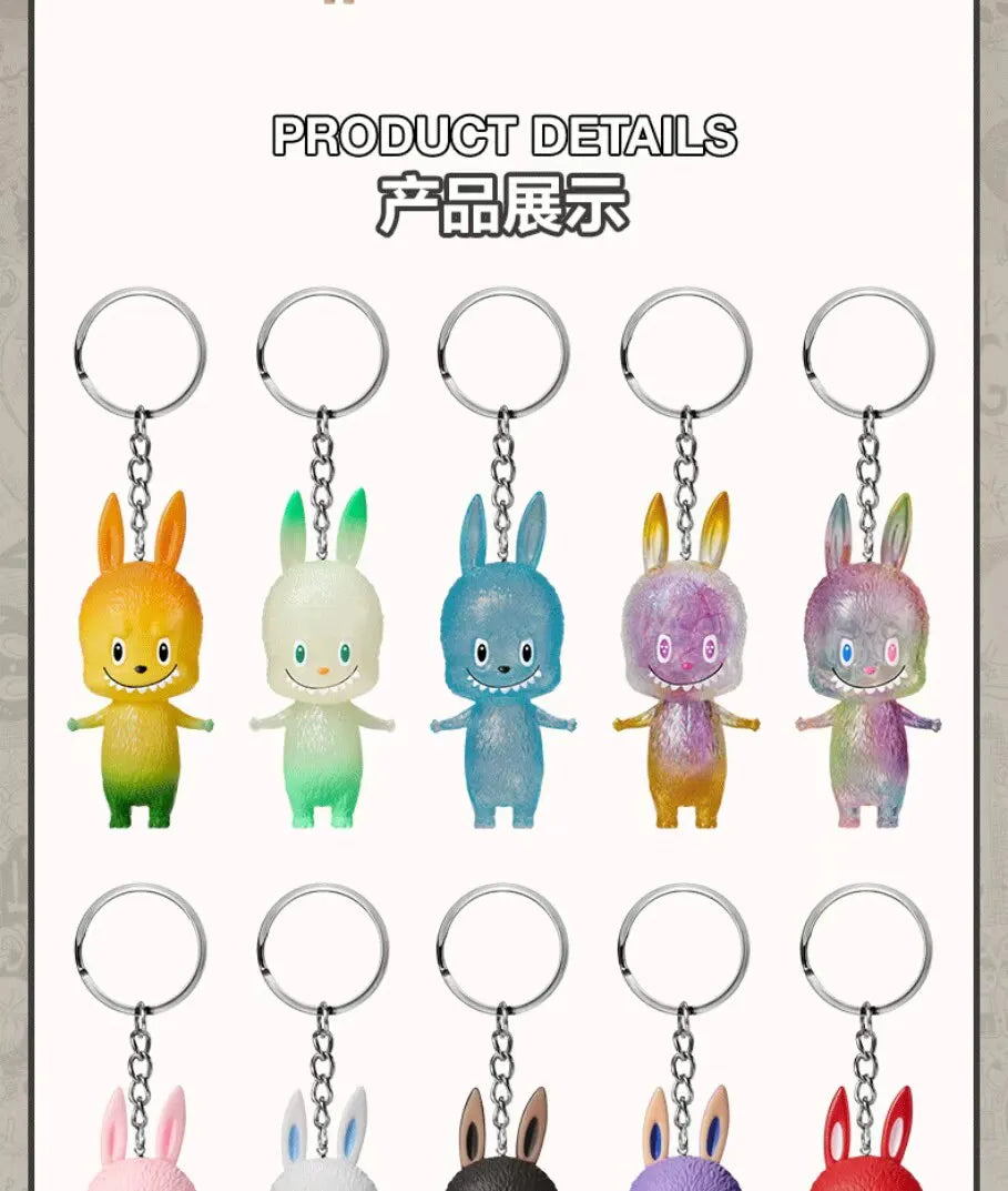 A collection of eight small, colorful rabbit-like figures from the Labubu series displayed on silver keychains.