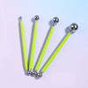 A set of four bright lime green clay sculpting tools with silver tips and handles for pottery and crafting.