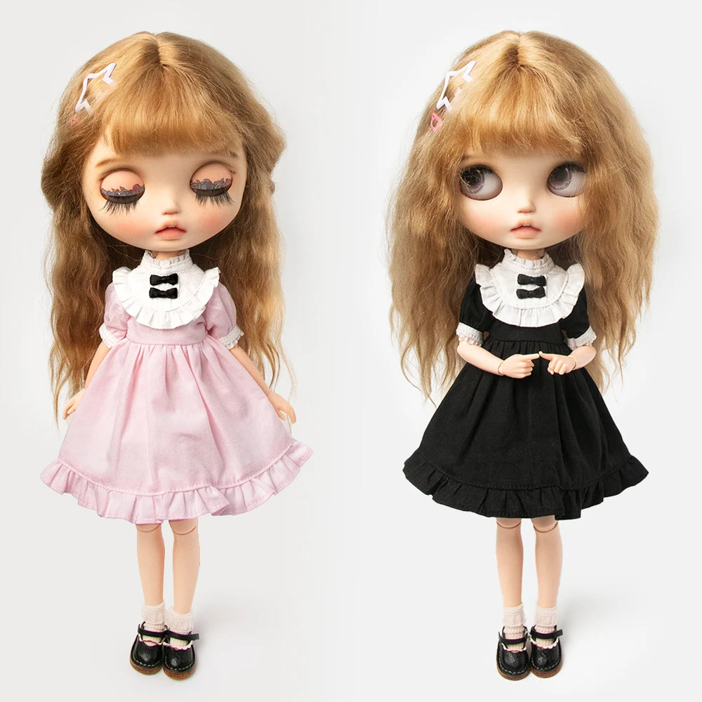 A pair of vintage lace maid dress sets for 1/6 scale dolls, featuring pink and black outfits.