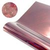 A close-up view of a pink holographic vinyl sheet with red glitter lines, showing the texture and finish.
