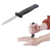 A hand is holding a black retractable realistic fake knife prank toy blade.
