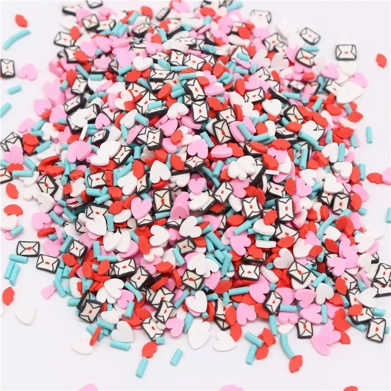 A pile of colorful polymer clay flower charms in various shapes and colors like pink, red, white, and blue.