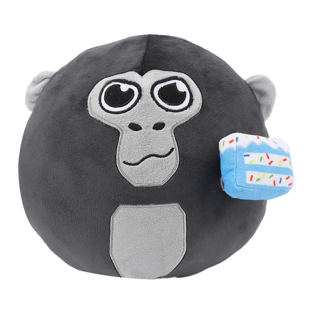 A dark gray gorilla plush toy with large eyes and a light gray chest patch, accompanied by a blue and white striped accessory