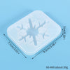 A square silicone mold with a snowflake design used for jewelry and craft projects.