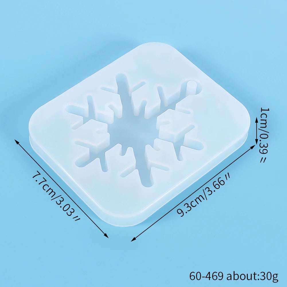 A square silicone mold with a snowflake design used for jewelry and craft projects.