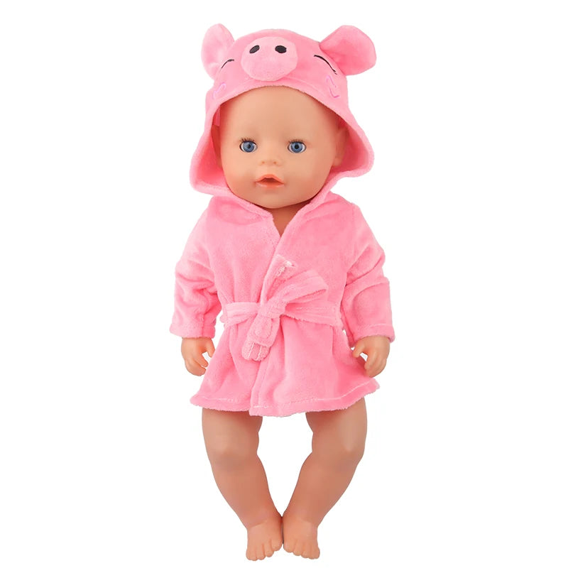 A pink cartoon pig bathrobe and nightgown set for a doll.