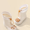 A pair of white kids' waterproof bear rain boots with anti-slip soles and leather accents.