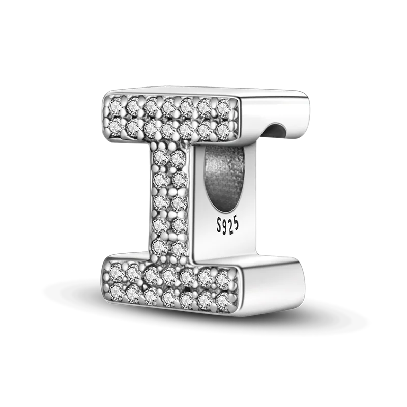 A sterling silver alphabet charm featuring a letter T encrusted with cubic zirconia stones.